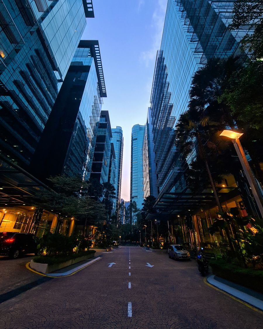 Modern glass architecture in Kuala Lumpur at dusk